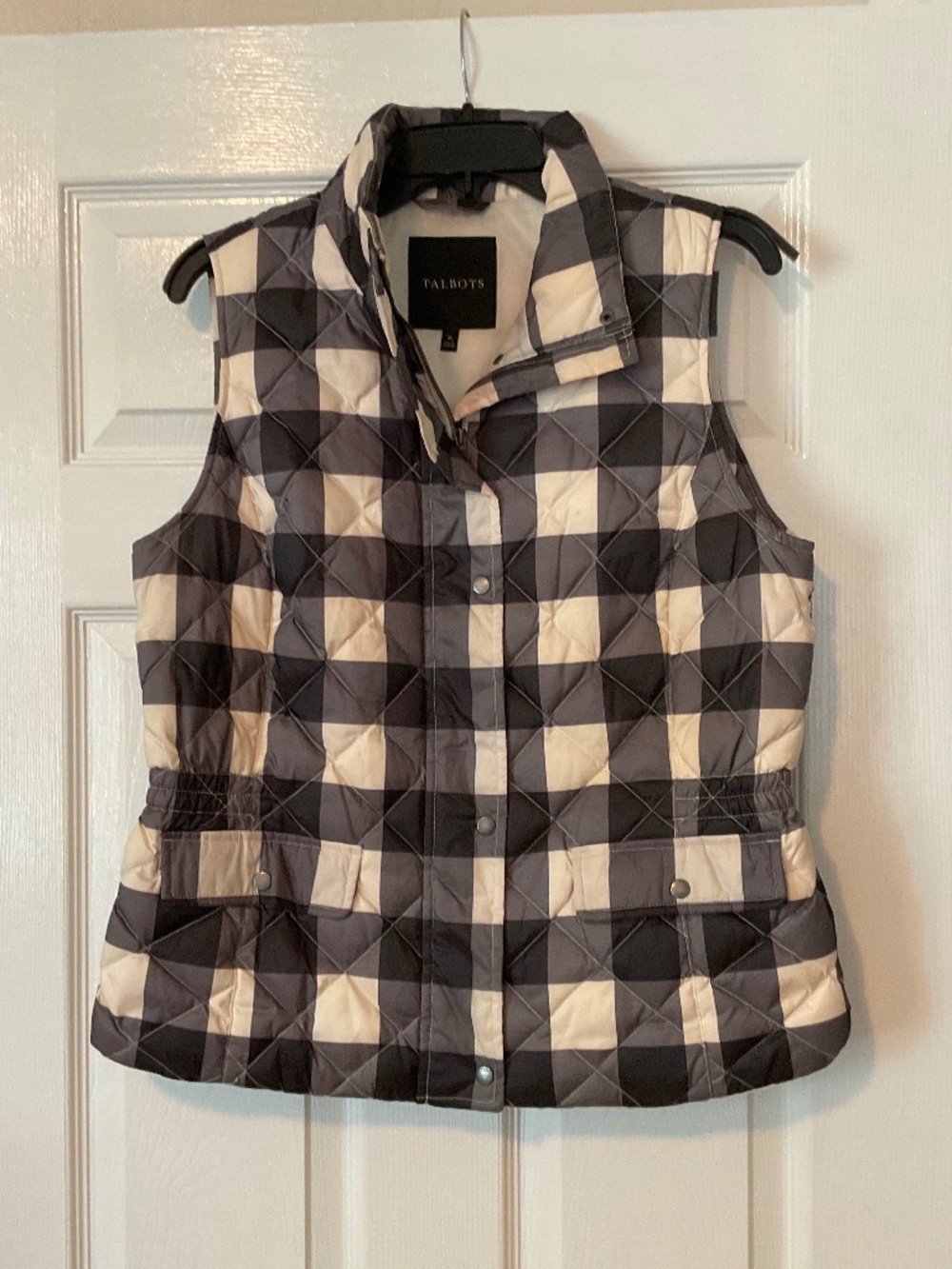 Ladies Talbots size medium black and white sleeveless puffer jacket.